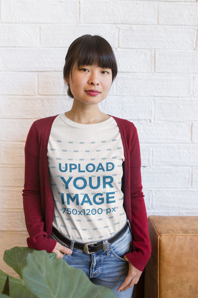 Portrait of a Woman Wearing a Tshirt Mockup at a Startup