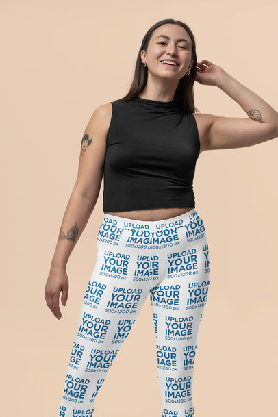 Leggings Mockup Featuring a Happy Woman Posing Against a Colorful Background