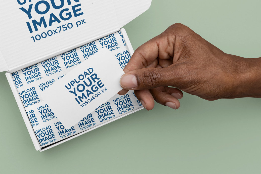 Box Mockup Featuring a Man Holding a Business Card