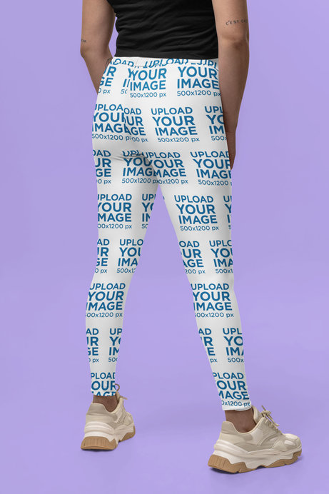 Back-View Leggings Mockup of a Tattooed Woman Posing in a Studio