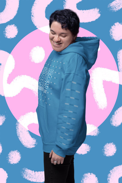 Mockup of a Happy Man Posing in a Gildan Hoodie with a Customizable Sleeve