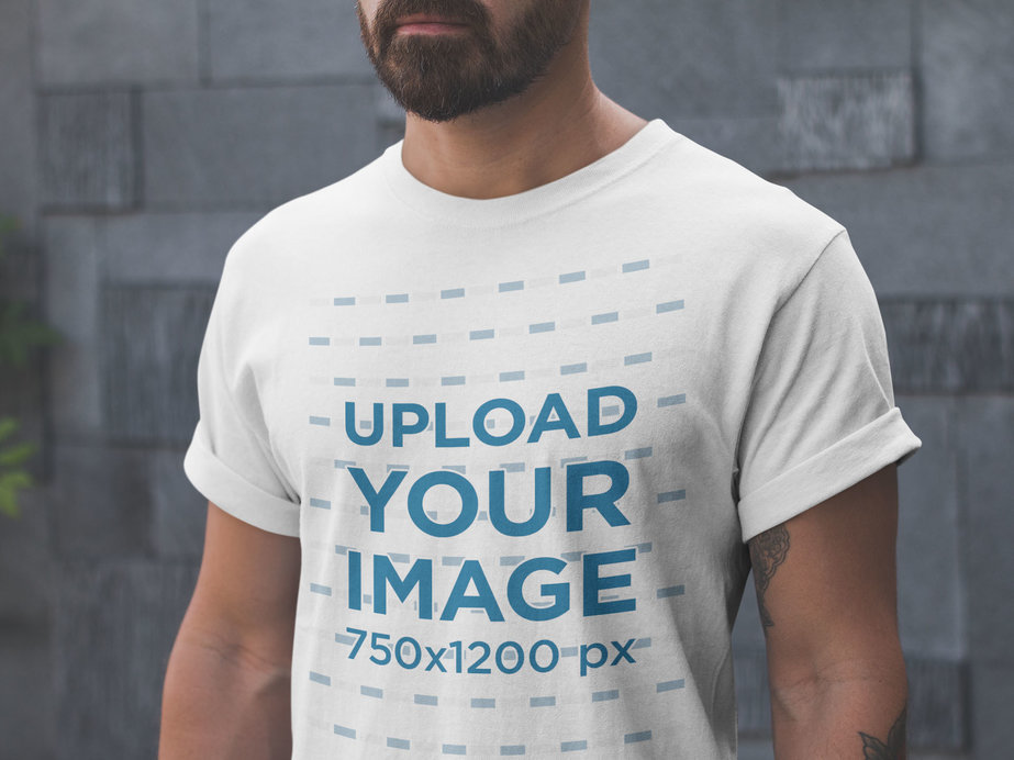 Closeup T-Shirt Mockup Being Worn by a Man with Tattoos and a Beard