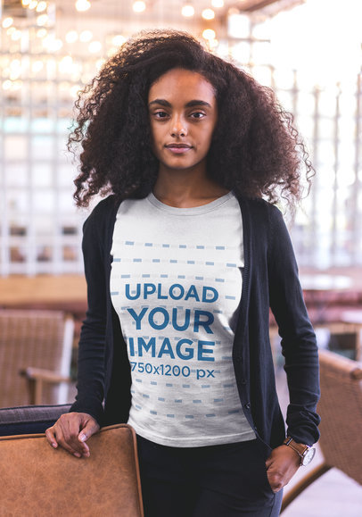Mockup of a Woman with Curly Hair Wearing a T-shirt 