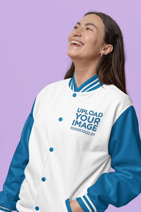 Bomber Jacket Mockup Featuring a Woman Posing With a Joyful Look