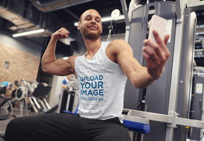 Tank Top Mockup Featuring a Happy Man Taking a Selfie at the Gym