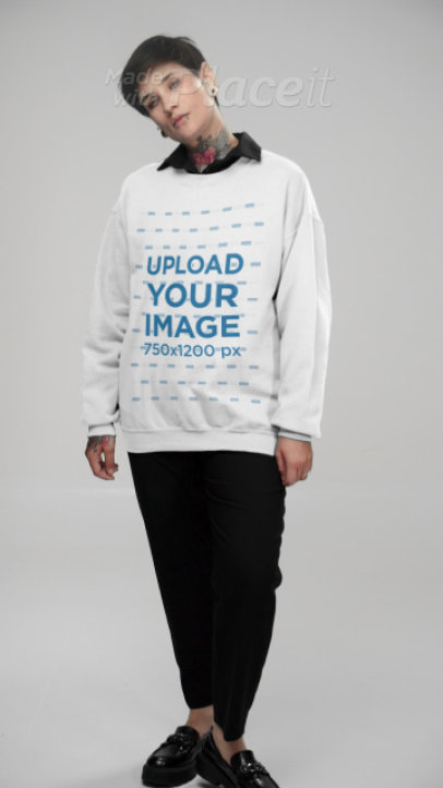 Crewneck Sweatshirt Video Featuring a Tattooed Woman Posing at a Studio