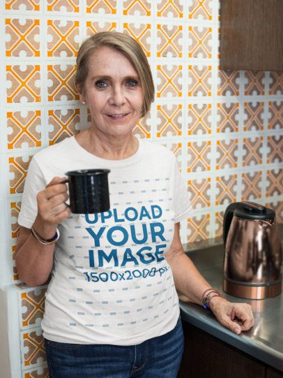 Senior Woman Wearing a T-Shirt Mockup While Having a Morning Coffee