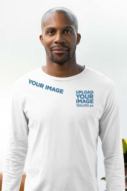 Mockup of a Man Wearing a Bella Canvas Long Sleeve Tee with Embroidered Elements