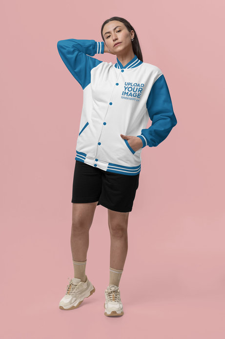 Bomber Jacket Mockup Featuring a Serious Woman Posing in a Studio