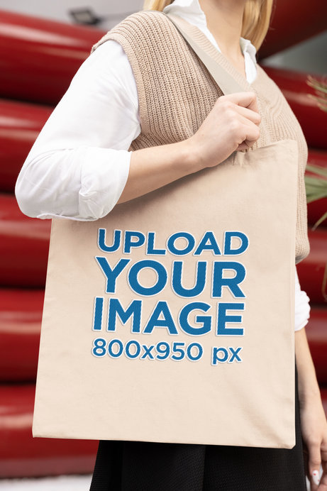 Closeup Mockup of a Woman Carrying a Tote Bag with Embroidered Elements
