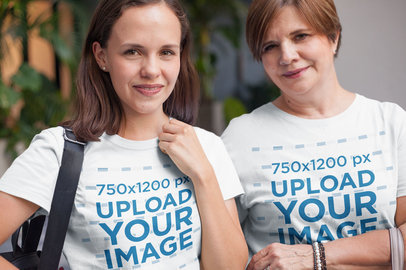 Daughter and Mom Wearing T-Shirts Mockup Taking a Walk Downtown