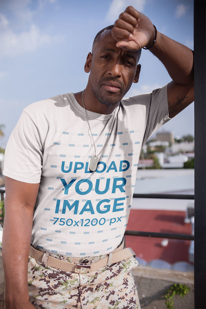 Veteran Wearing a Tshirt Mockup and Military Pants