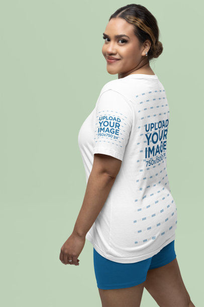 Back-View Mockup of a Woman in a Bella Canvas Tee with a Customizable Sleeve