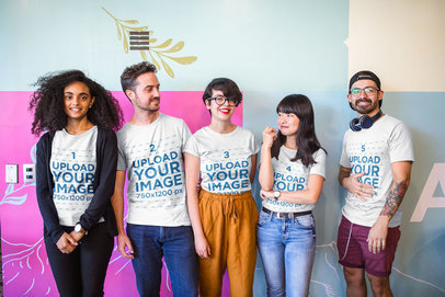 Interracial Group of Five Coworkers Wearing T-Shirts Mockup at a Startup