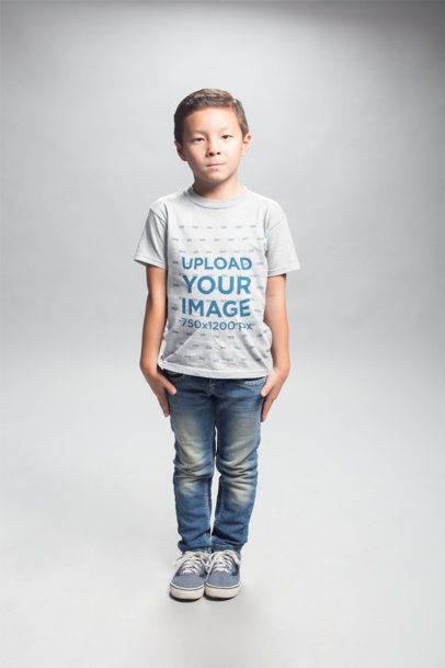 Serious Boy Wearing a T-Shirt Mockup in a White Room