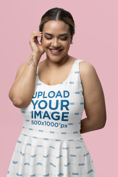 Mockup of a Woman with a Wrist Tattoo Wearing a Sublimated Skater Dress