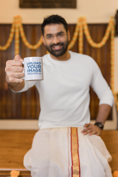 Mockup of a Man Holding an 11 oz Coffee Mug Close to the Camera