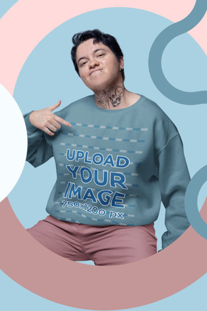Mockup of a Tattooed Man Pointing at His Gildan Sweatshirt m32891