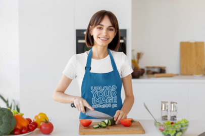 Embroidered Apron Mockup of a Smiling Woman Cutting Vegetables