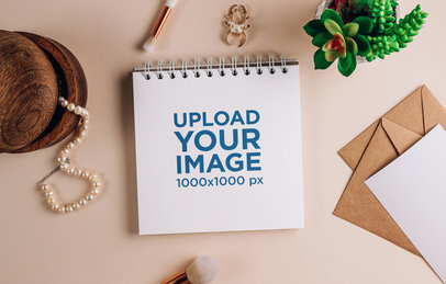 Mockup of a Notebook Featuring Makeup Brushes and a Pearl Necklace m32114 r-el2