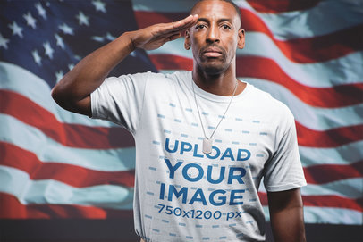 Veteran Soldier Wearing a T-Shirt Mockup Saluting Against the Flag