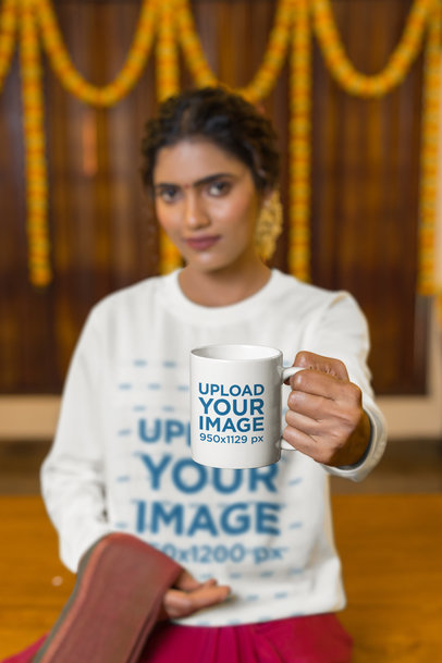 Mockup of a an 11 Oz Mug Featuring a Blurry Woman Wearing a Sweatshirt m33120