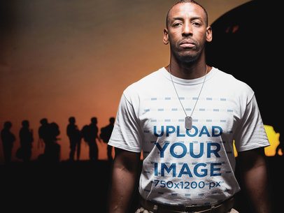 Veteran Wearing a Round Neck Tee Mockup Against a Picture of the Army