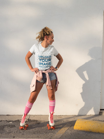 Smiling Woman Wearing a T-Shirt Mockup while Using Roller Skates