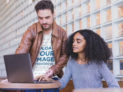 Serious Man with a Beard Wearing a T-Shirt Mockup while Coaching a Coworker