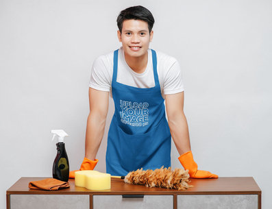 Apron Mockup Featuring a Man With Cleaning Tools Posing in a Studio