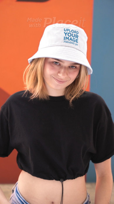 Bucket Hat Video Featuring a Smiling Woman Posing for a TikTok