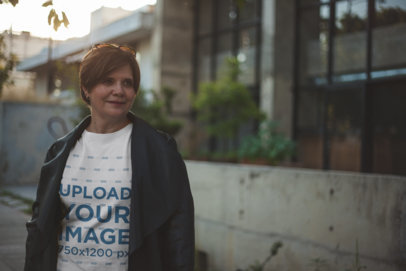 Lady Wearing a T-Shirt Mockup Walking Down the Street