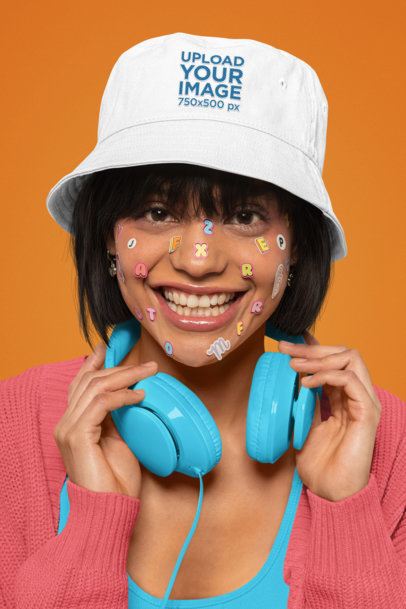 Closeup Mockup of a Cheerful Woman Wearing a Bucket Hat