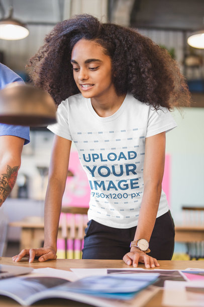 Woman Wearing a T-Shirt Mockup while at a Reunion in a Startup