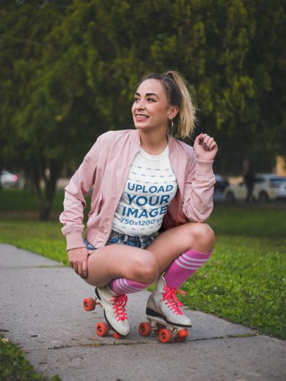 Smiling Trendy Woman Wearing a T-Shirt Mockup while Roller Skating at a Park