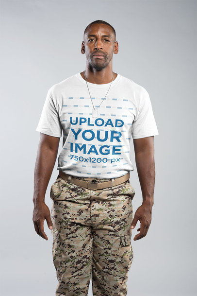 Portrait of a Veteran Soldier Wearing a Round Neck T-Shirt Mockup in a White Room