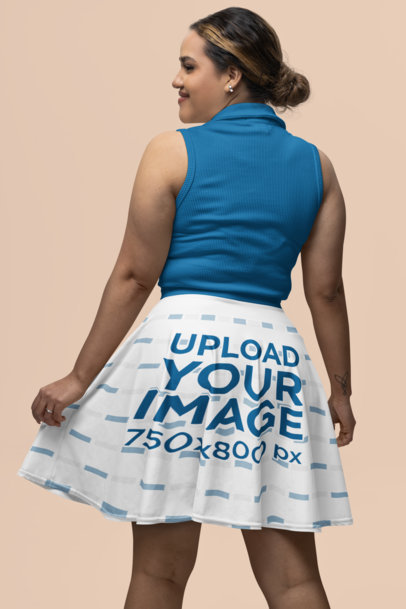 Back-View Skater Skirt Mockup Featuring a Smiling Woman in a Studio