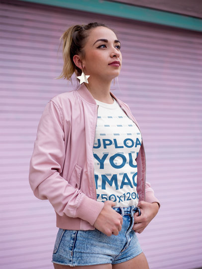 Woman Wearing a Round Neck T-Shirt Mockup Against a Pink Curtain