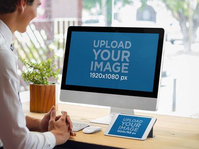 iPad and iMac Mockup Featuring a Man in the Office