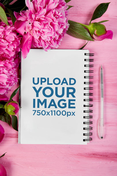 Notebook Mockup Featuring Flowers and a Pen