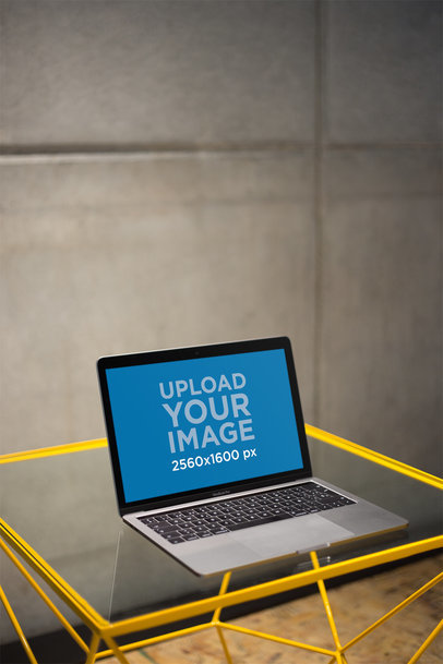 MacBook Mockup Standing on a Glass Desk