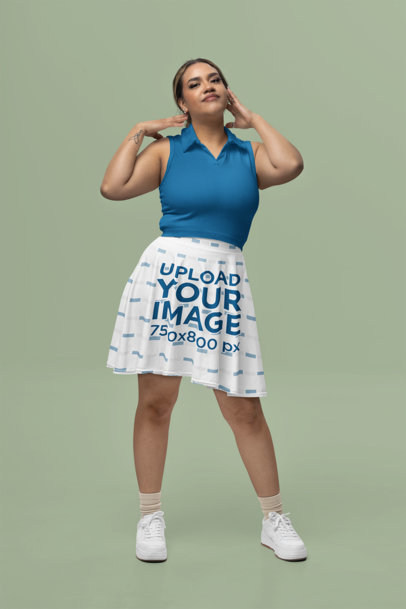 Skater Skirt Mockup of a Smiling Tattooed Woman Posing in a Studio