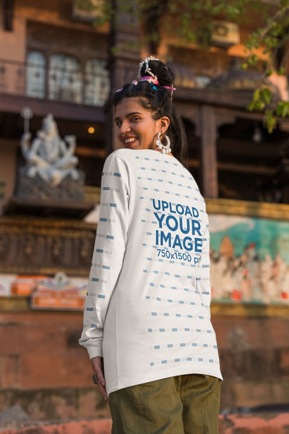 Back-View Mockup of a Woman with Big Earrings Wearing a Bella Canvas Long Sleeve Tee