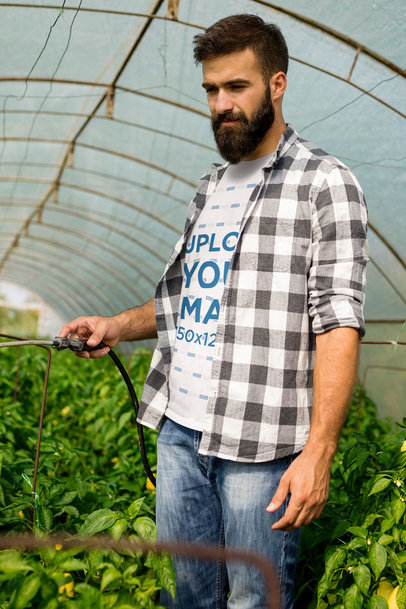 Labor Day-Themed Mockup of a Bearded Man in a T-Shirt Watering Plants