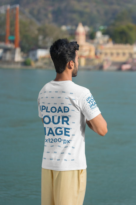 Back-View T-Shirt Mockup of a Man Meditating Near a River