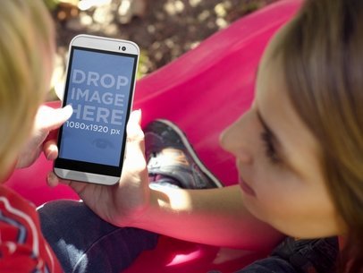 Android Phone Mockup Featuring a Mom and Her Son