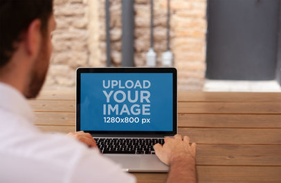 Corporate Man Working on a MacBook Mockup