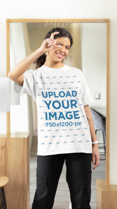 T-Shirt Video Featuring a Joyful Woman Posing Against a Mirror