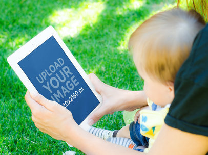 Baby and Mom With iPad at the Backyard