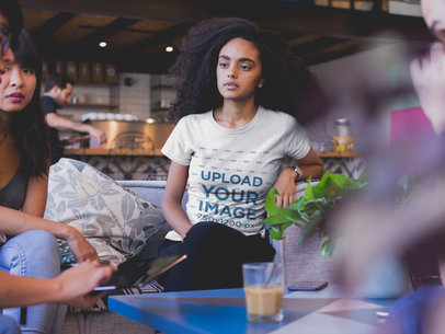 Woman with Curly Hair Wearing a T-shirt Mockup at a Friends Reunion
